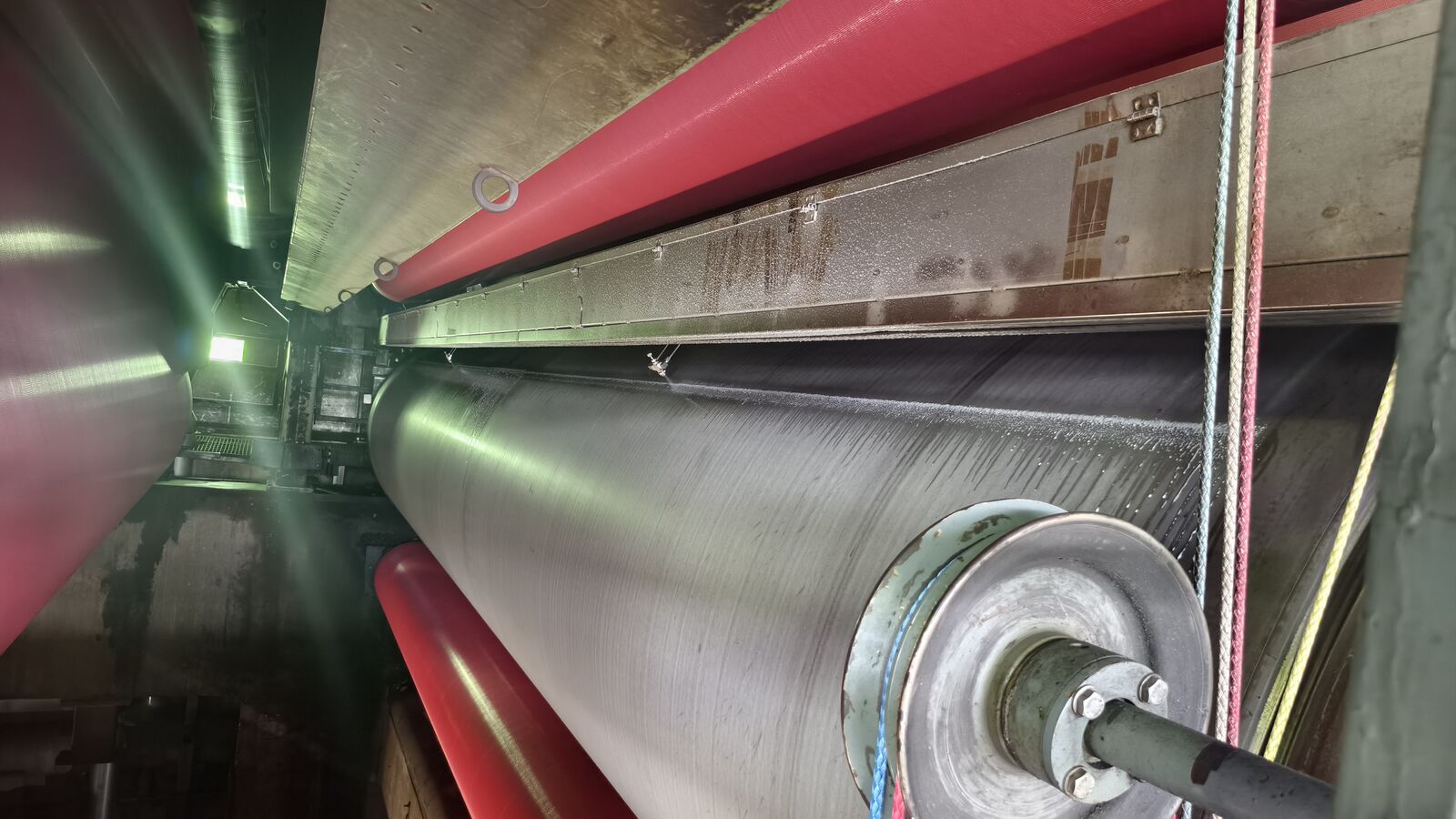 Release agent being applied to a paper machine dryer cylinder