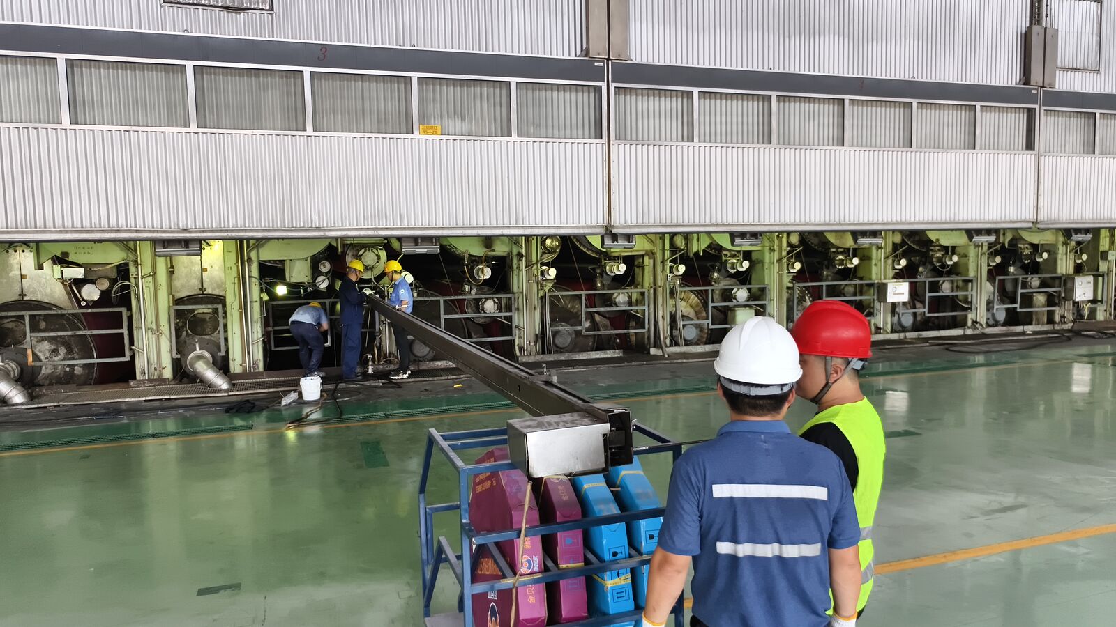 Baozt engineer inspecting a spray system in a paper mill